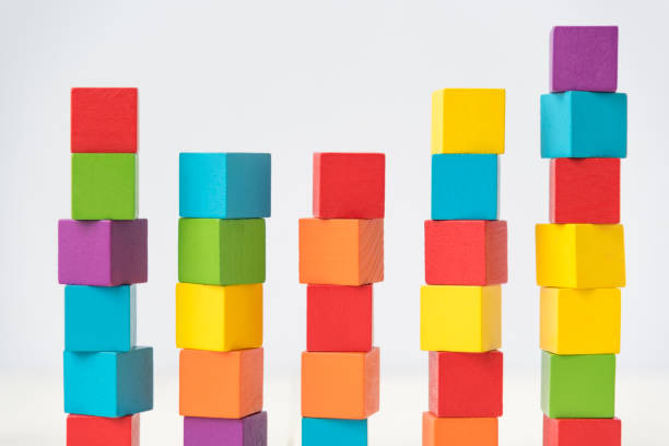 istock Close-Up Stack Of Multi Colored Toy Blocks Over White Background 1029361170