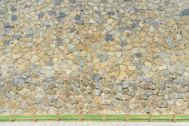 istock Old castle stone wall in japan garden background and texture concepts. 1029361398