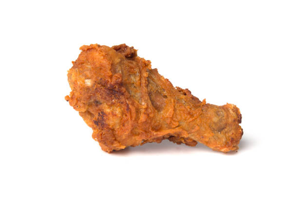 istock Crispy fried chicken leg isolated on a white background 1029366472