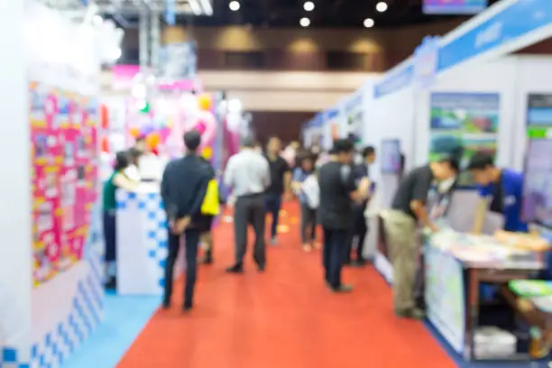 Photo of Abstract blurred event exhibition with people background, business convention show concept