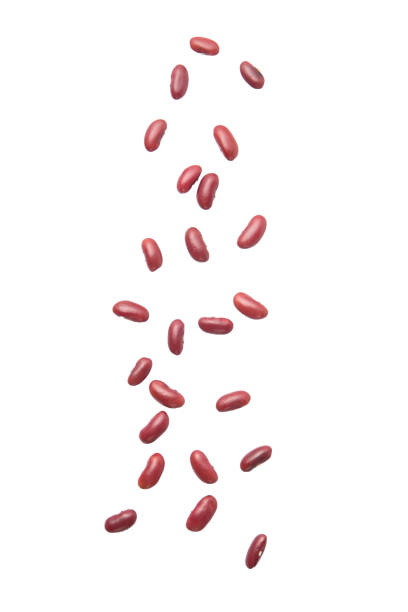 red beans falling isolated on the white background - falling beans imagens e fotografias de stock