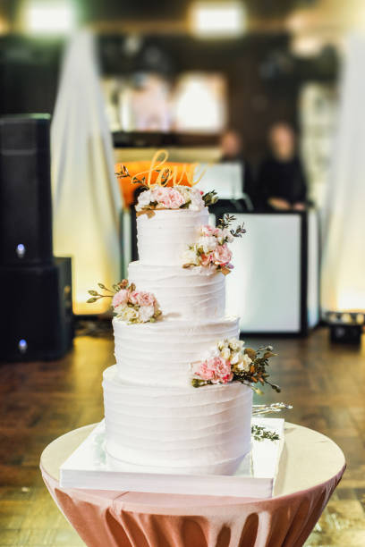 istock Beautiful white wedding cake. Wedding cake with flowers. 1029369060