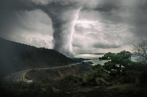Dramatic Tornado View horizontal image with tornado near the city. Nature power concept. Climate change. Weather illustration. Adventure travel conceptual photography.
