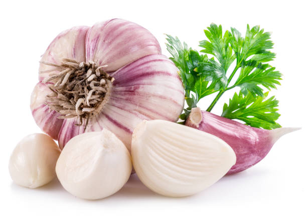 istock Garlic bulb, garlic cloves and parsley. 1029369338