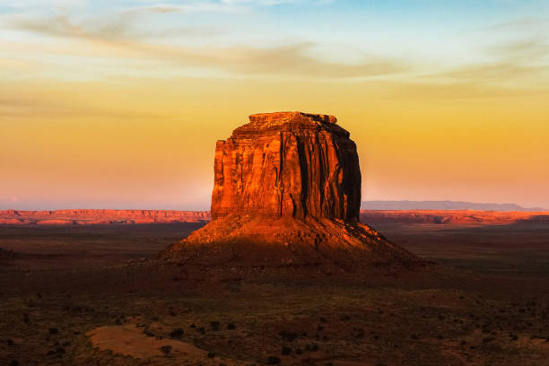 Creative illustration in vintage watercolor design - Monument Valley in USA, red panorama with blue sky