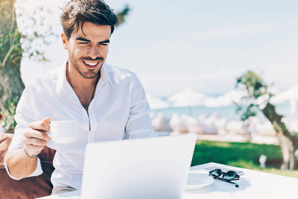 istock Wealthy young man working outdoors 1029372882