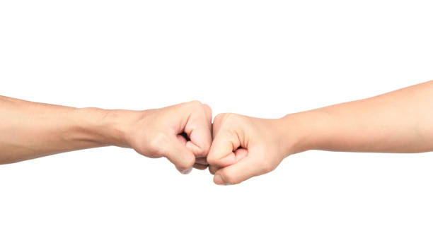 istock Hands giving a fist bump on white background 1029378002