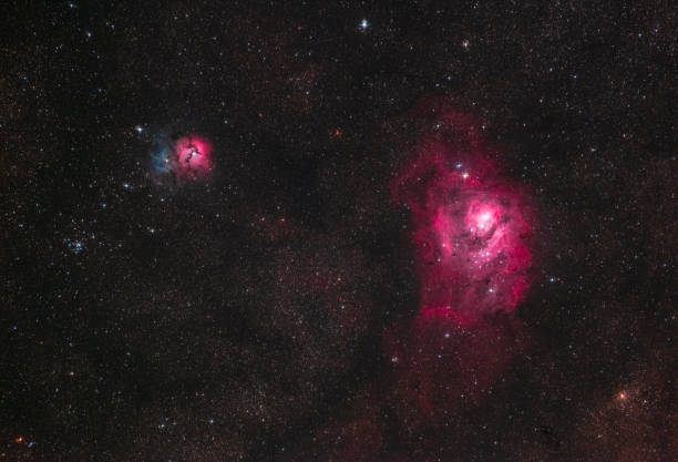 istock M8 and M20 - The Lagoon and Trifid Nebulae 1029382692