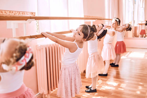 istock young ballerinas exercising together 1029382806