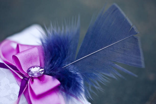 istock Pillow for wedding rings, with a blue feather 1029383044