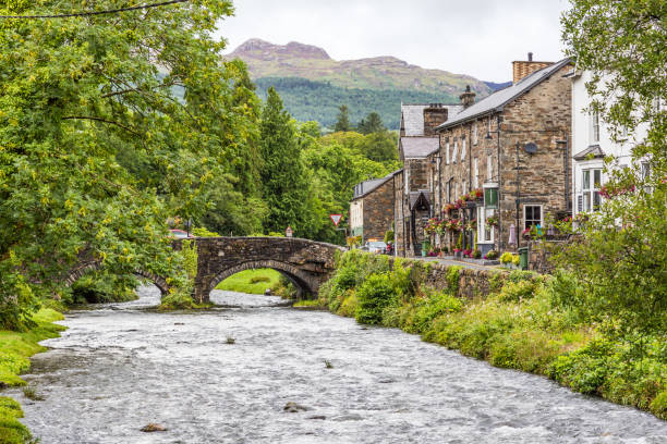 Beddgelert town in Snowdonia NP, Wales, UK Beddgelert town and bridge in the heart of Smowdonia National Park in Gwynedd, Wales, UK gwynedd photos stock pictures, royalty-free photos & images