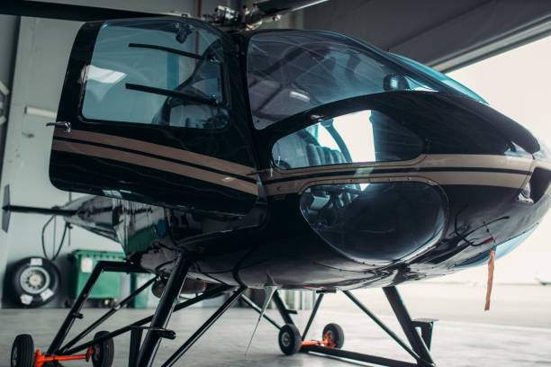 istock Small helicopter in hangar, private airline copter 1029391790