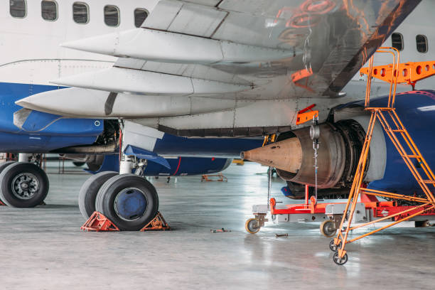 istock Jet airplane in hangar, inspection before flight 1029391968