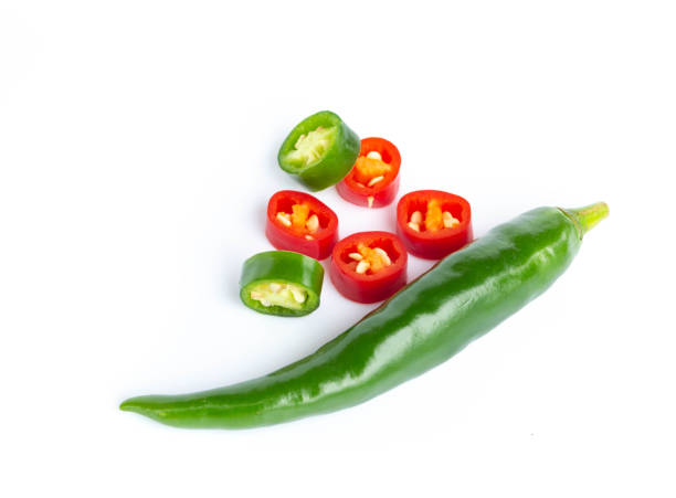 istock Green chili peppers Isolated on white background. 1029392124