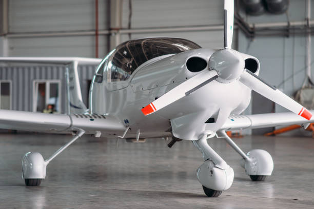 istock Small private turbo-propeller airplane in hangar 1029392186