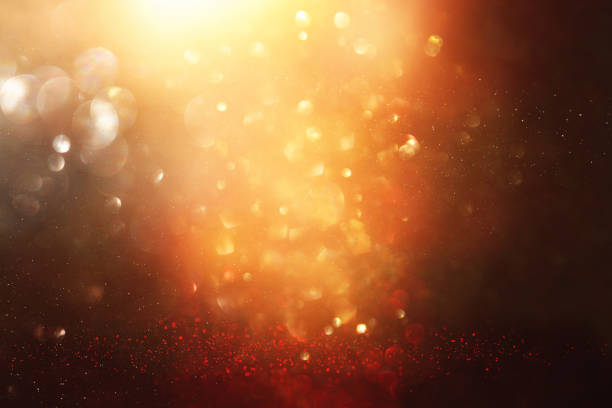 istock glitter vintage lights background. black and gold. de-focused. 1029392206
