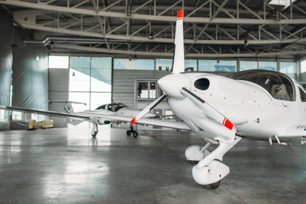 istock Small private turbo-propeller airplane in hangar 1029392330