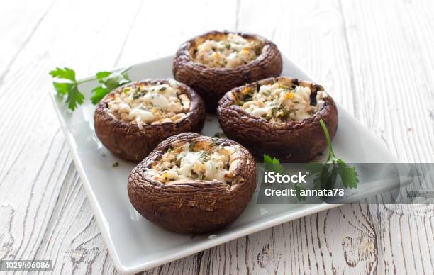 Mushrooms Stuffed With Cheese And Greens Stock Photo - Download Image Now - Edible Mushroom, Stuffed, Baked