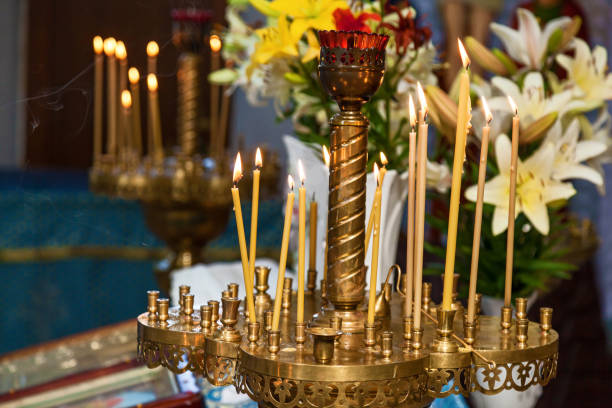 istock burning wax candles in the church 1029406266