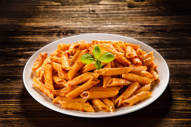 istock Penne, pesto sauce and vegetables 1029406290