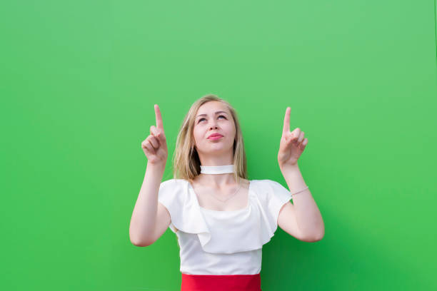 istock Blonde young woman presenting goods 1029417018