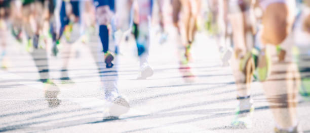 marathon runners in the city background