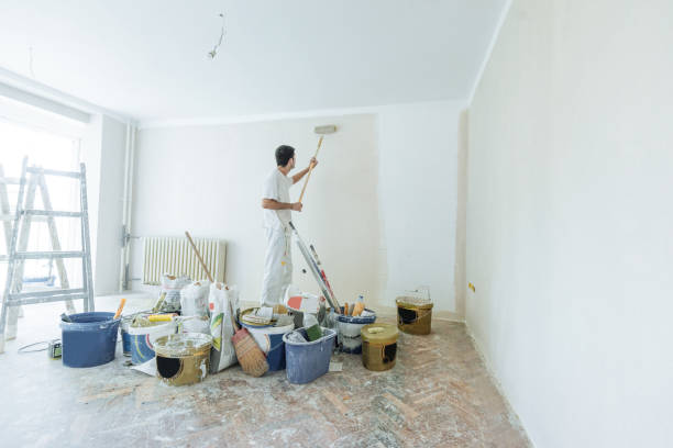 property service - architect painters and workers Professional contractors refurbishing the apartment - interior designer, painters and electricians renovating the nice apartment in the building house painting service stock pictures, royalty-free photos & images