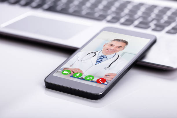 istock Mobile Phone Showing Video Conference Of A Doctor 1029428124