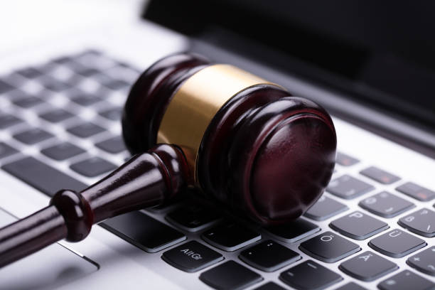 istock Wooden Gavel On Laptop 1029428134