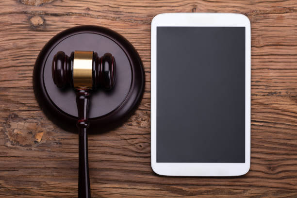 istock Wooden Mallet And Gavel With Tablet 1029428138