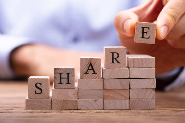 istock Man's Hand Placing Last Alphabet Of Word Share 1029428148