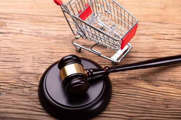 istock Judge Gavel And Shopping Cart On Table 1029428176