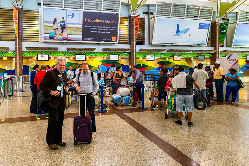 SANTO DOMINGO - DOMINICAN REPUBLIC - January 19, 2017 : Interior view of Santo Domingo Las Americas international airport with passengers in Dominican Republic.