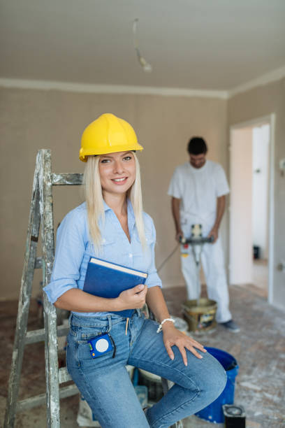 istock Young professional engineer with workers in the property 1029428832