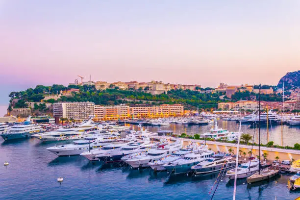 Photo of Old town of Monaco overlooking port Hercule during sunset