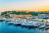 Old town of Monaco overlooking port Hercule during sunset
