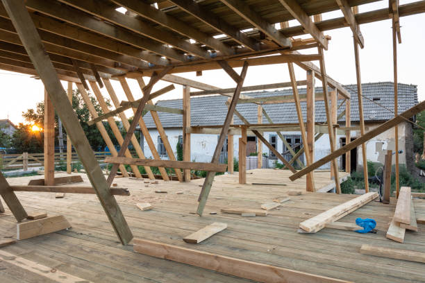 istock New construction home framing against blue sky at sunset 1029452026
