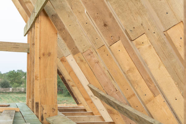istock Roof frame structure in wood frame home under construction at sunset 1029452122