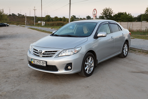 Novoselivka, Dnipropetrovsk region, Ukraine - august 29, 2018: Toyota corolla gray color near the samara river in twilight time