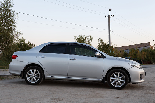 Novoselivka, Dnipropetrovsk region, Ukraine - august 29, 2018: Toyota corolla gray color near the samara river in twilight time