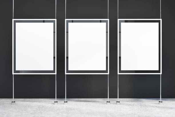 istock Row of vertical posters in a black wall room 1029462170