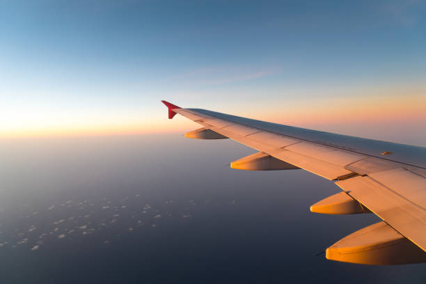 istock Clouds and sky sunny day through airplane window 1029464186