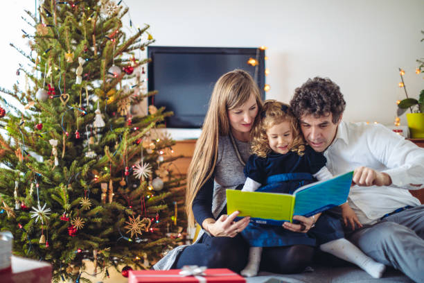 istock Father is reading a Christmas fairy tale 1029478022
