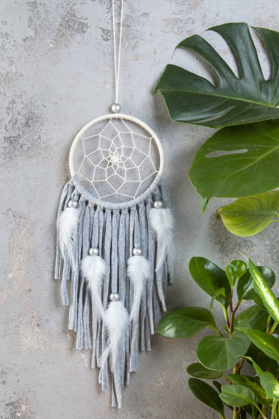istock Gray beige dream catcher on gray 1029479124
