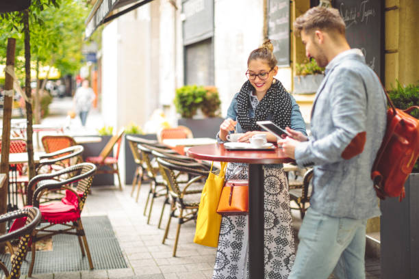 istock Friends are having a hot drink in a sidewalk cafe 1029482006