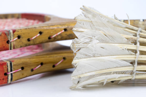 Old badminton accessories on a light table. Set for outdoor games and games. White background.