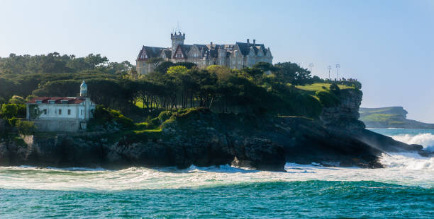 palace of la magdalena and la cerda lighthouse from santander bay, spain - santander imagens e fotografias de stock