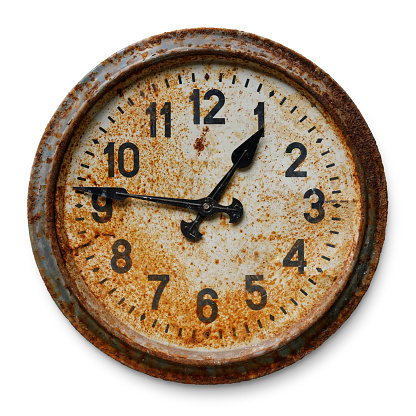 Antique wooden wall clock with Roman numerals, time concept
