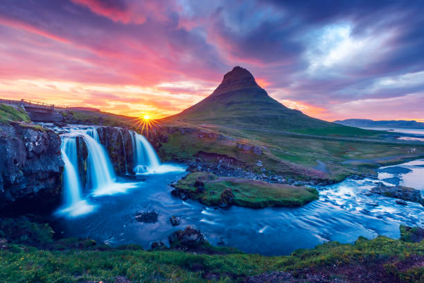 istock Colorful sunrise on Kirkjufellsfoss waterfall 1029488450
