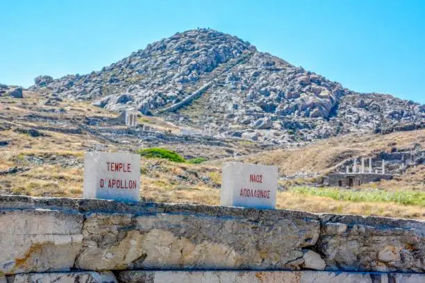 Photo of Ancient ruins in the island of Delos in Cyclades, one of the most important mythological, historical and archaeological sites in Greece.